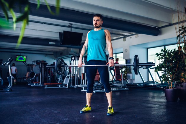 Crossfit instructor at the gym doing Deadlift exercises