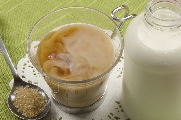 tea glass with milk and brown sugar