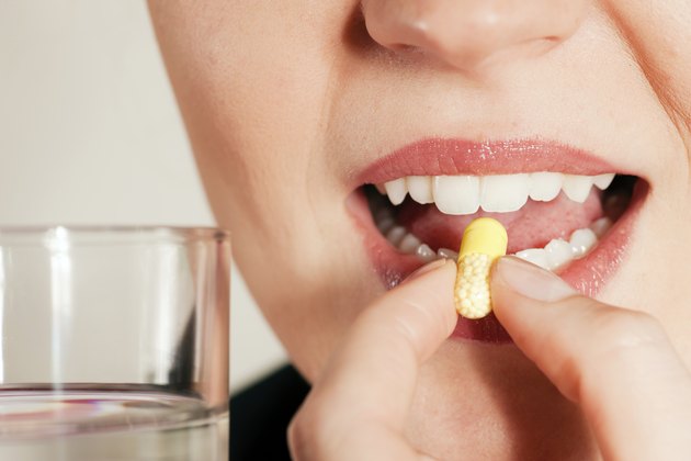 Woman taking a pill