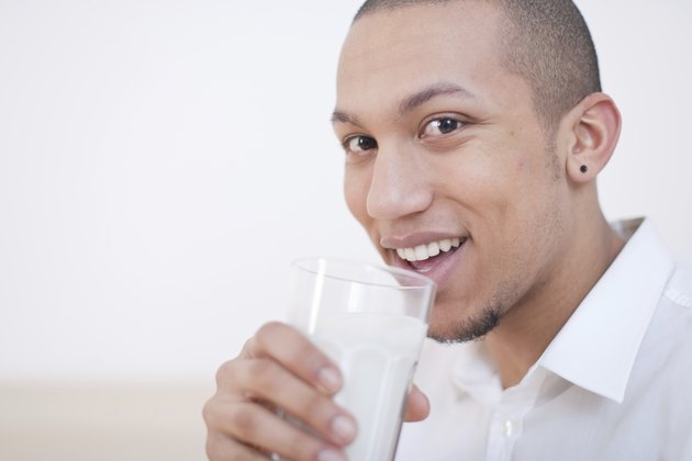 Young African-American Man Drinking Milk