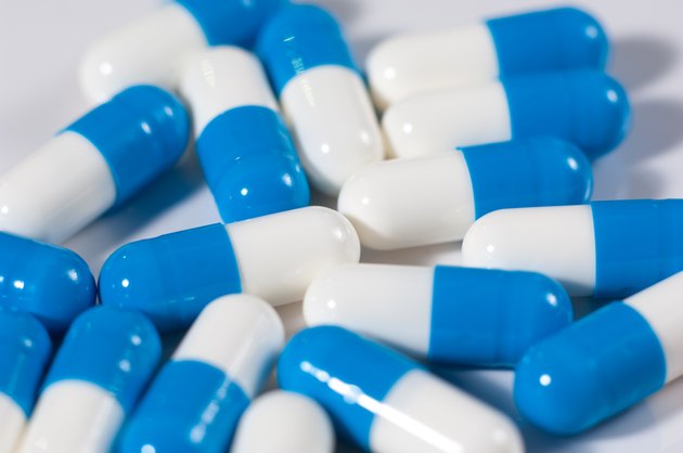 Background of blue and white capsule pills