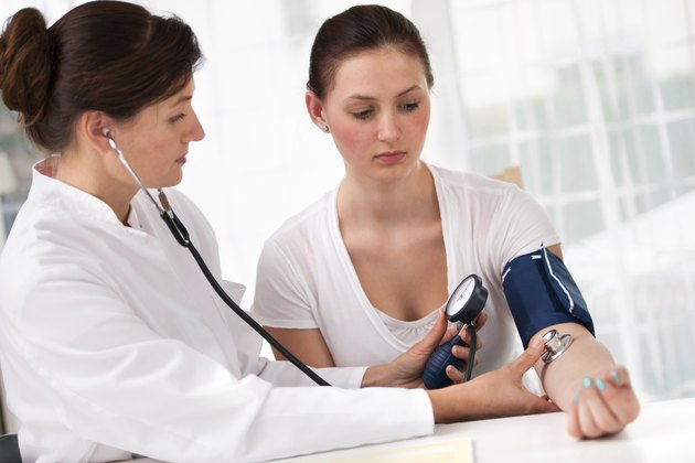 checking blood pressure