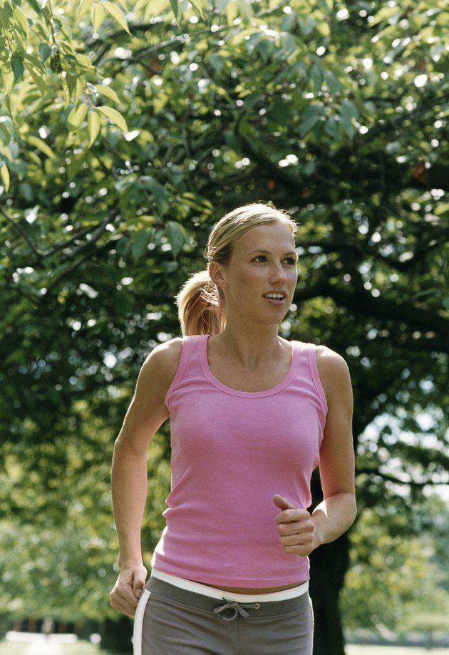 Woman Jogging Through a Park