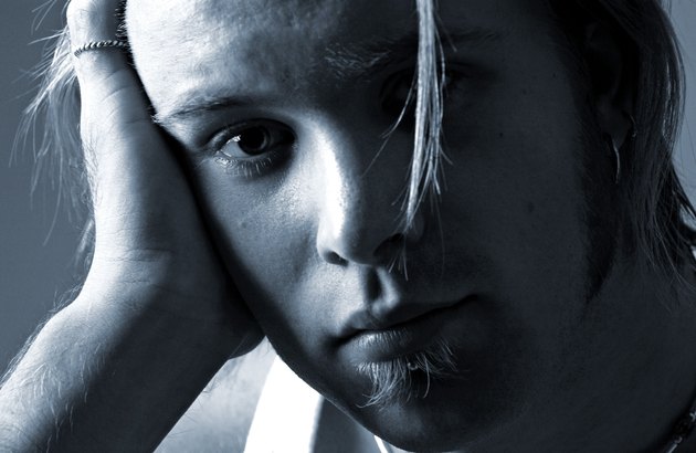 Close-up of a young man looking at camera