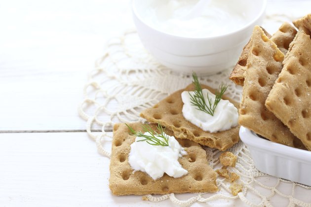 Snack gluten free crackers with cream cheese and dill