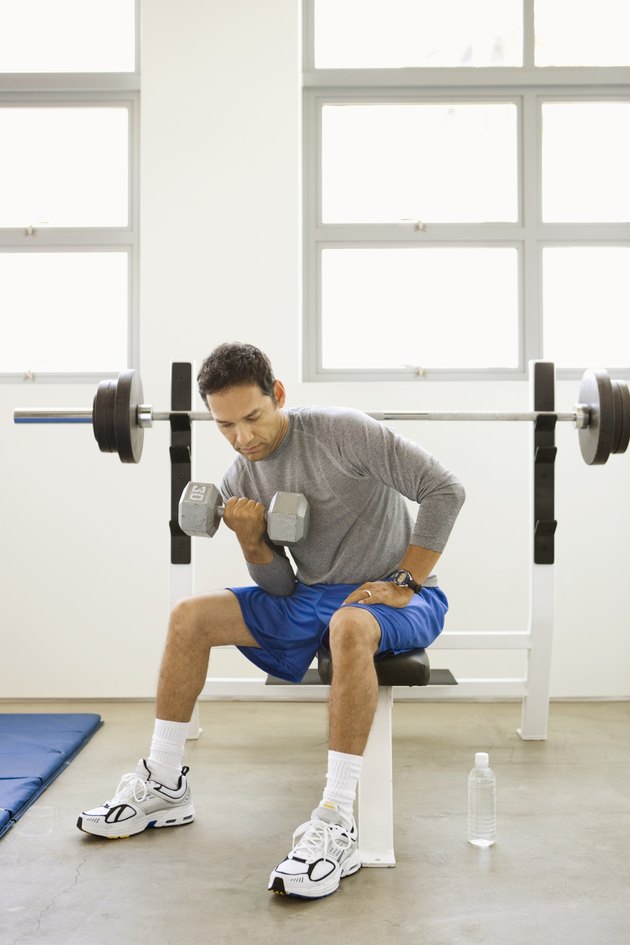 Man lifting weights in gym