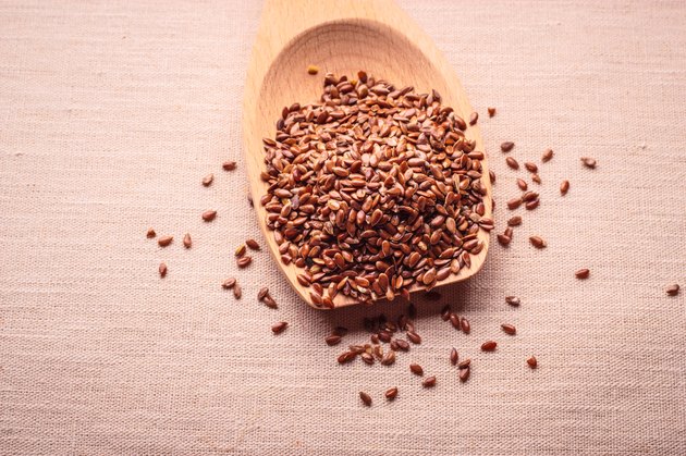 Flax seeds linseed on wooden spoon