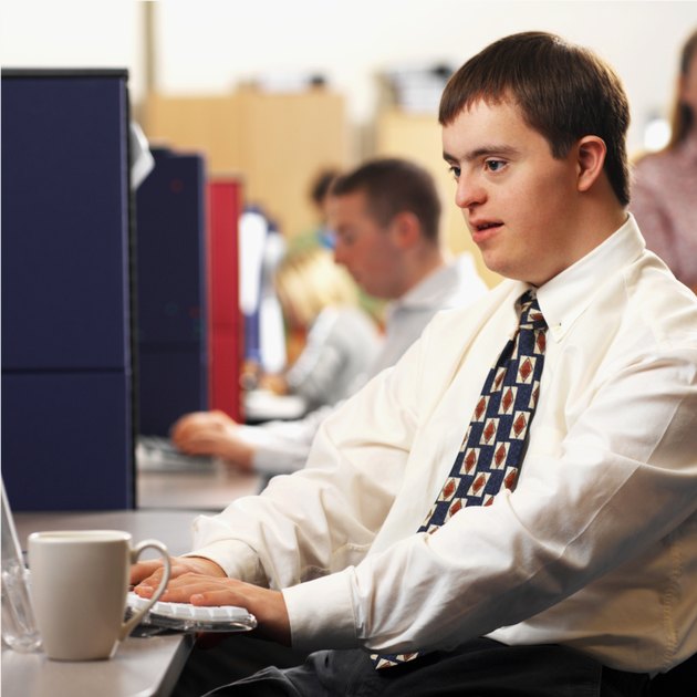 man with down syndrome working in an office