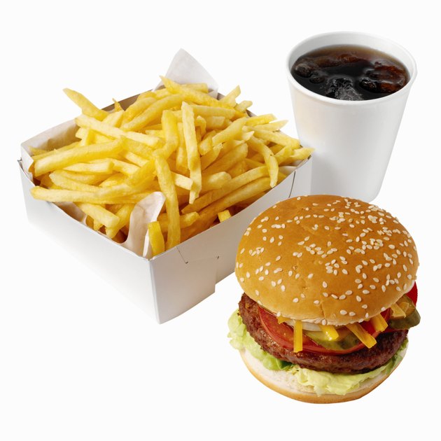 Close-up of burger and french-fries with cold drink