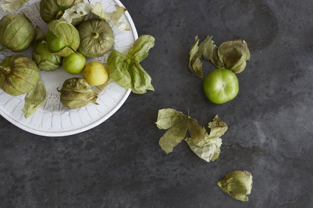 Fresh tomatillos on a plate.