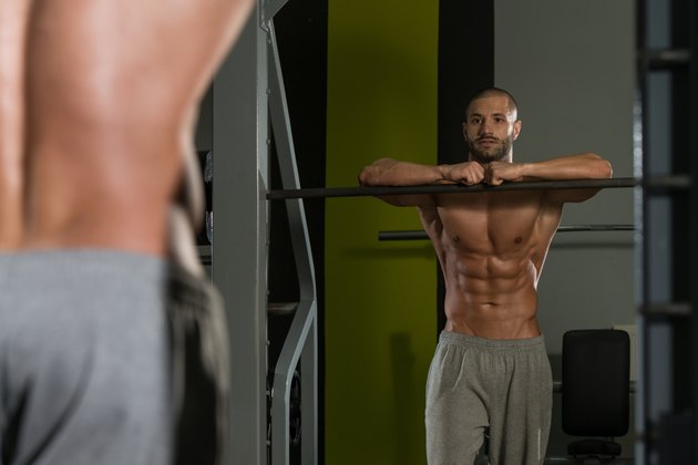 Portrait Of A Muscular Man Relaxing In Gym