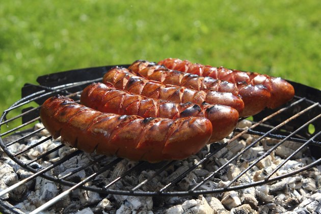 Grilling Sausages on barbecue grill