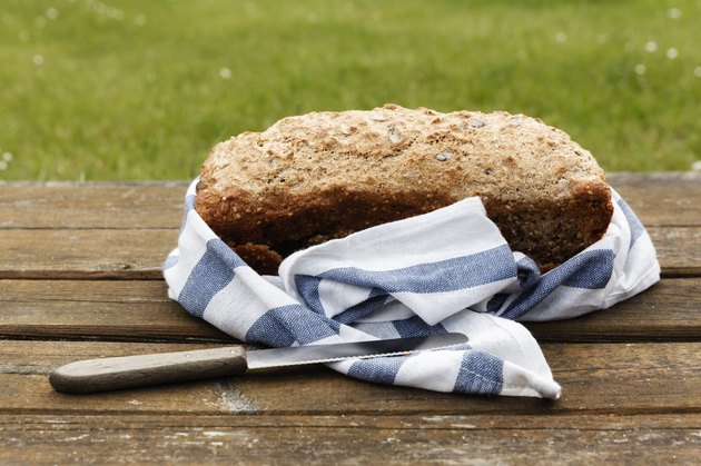 Wholemeal wheat spelt bread on wooden table