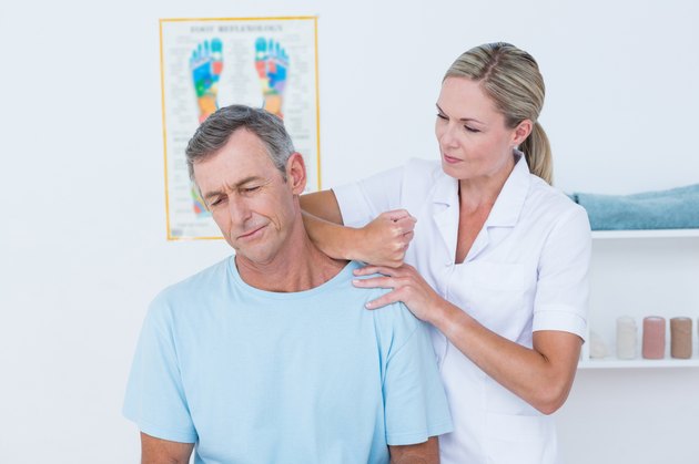 Doctor stretching her patient neck