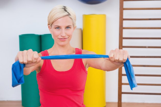 Blonde woman stretching arms