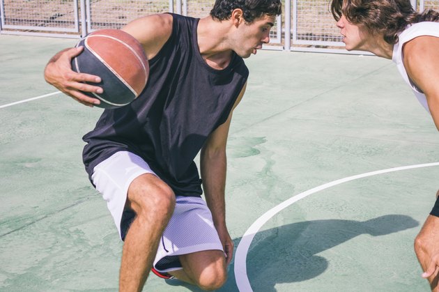 Men playing basketball
