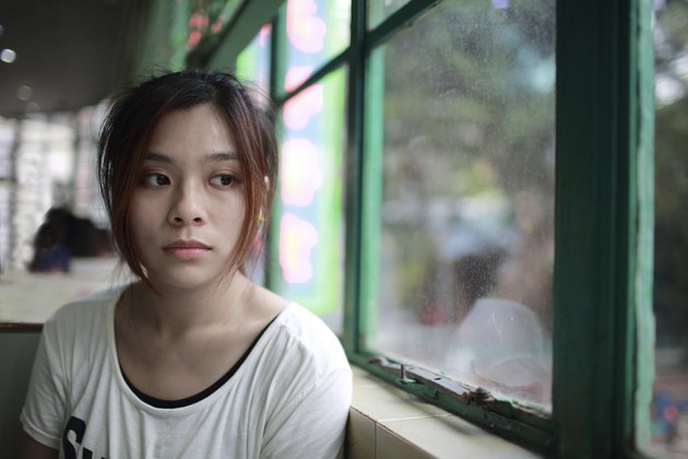 Sad woman waiting someone who is late