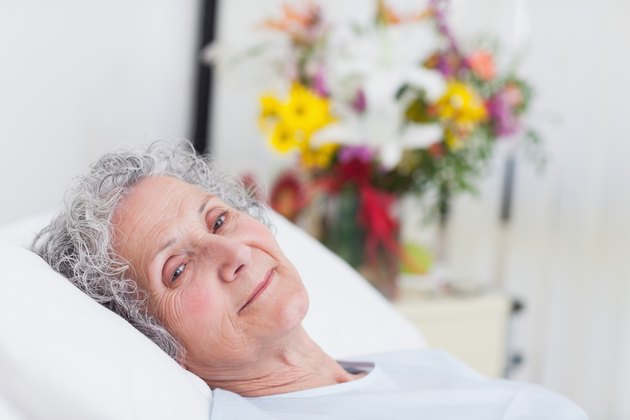 Peaceful senior woman lying in a hospital bed