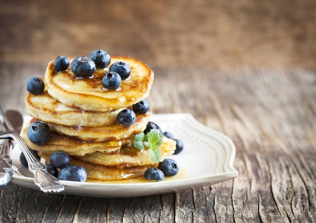 Stack of pancakes with fresh blueberry and honey