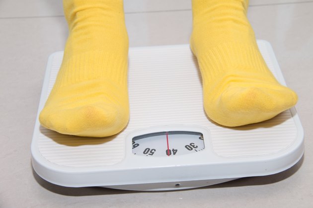 Closeup of a Asians weighed