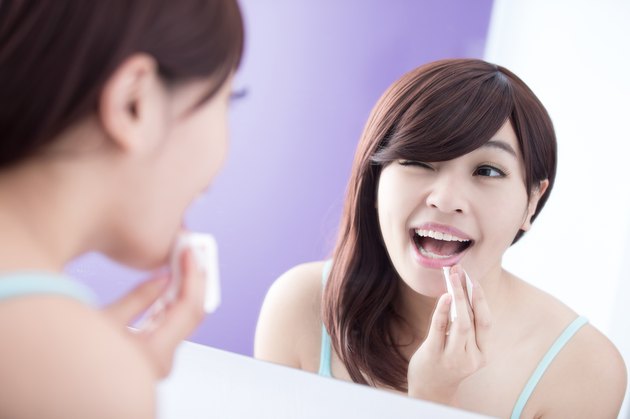 Smile woman remove makeup