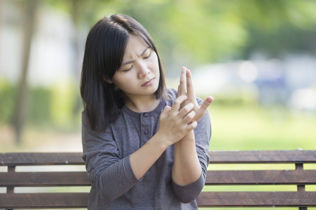 Woman Scratching Her Hand