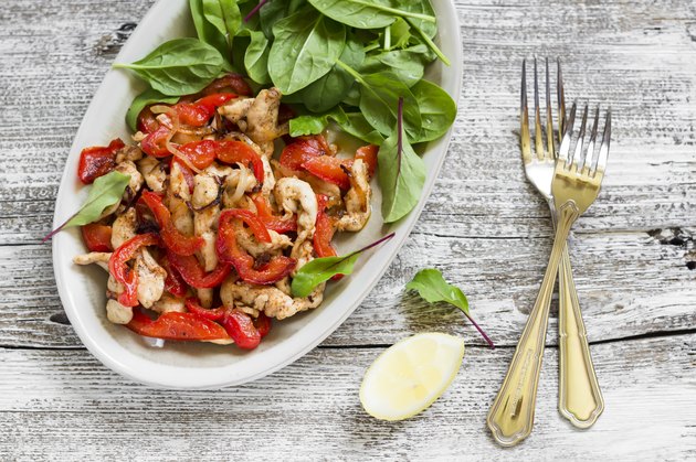 stir fry of chicken breast and pepper and fresh spinach