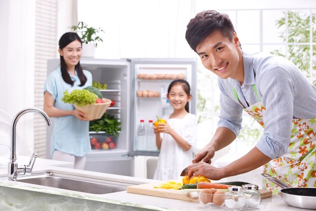 Family cooking in kitchen