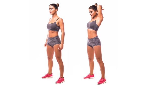 young woman doing exercise Triceps Stretch