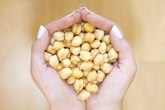 Chickpeas in woman hands