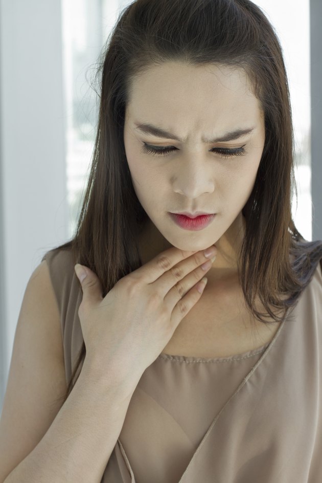 sick woman with throat problem