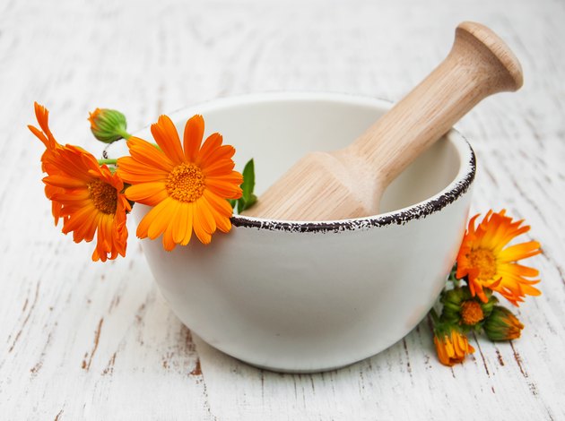 flower of calendula officinalis in mortar