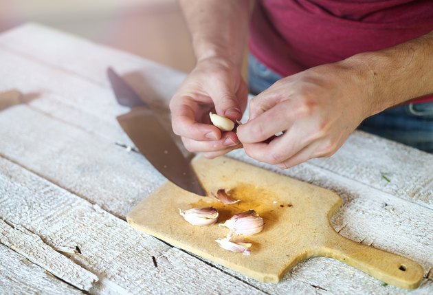 Man peeling garlic