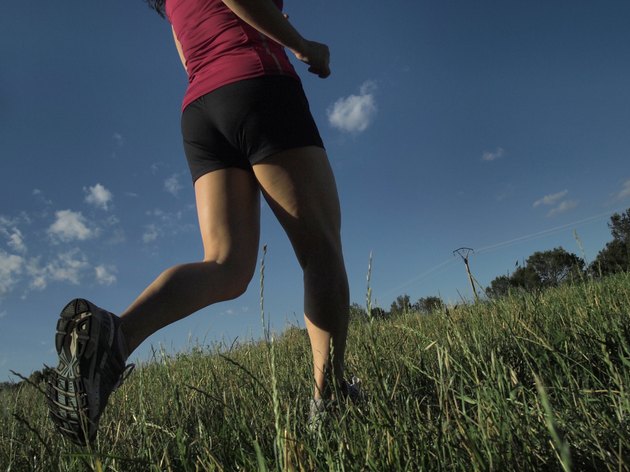 woman running across field