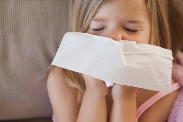 Cute little girl suffering from cold