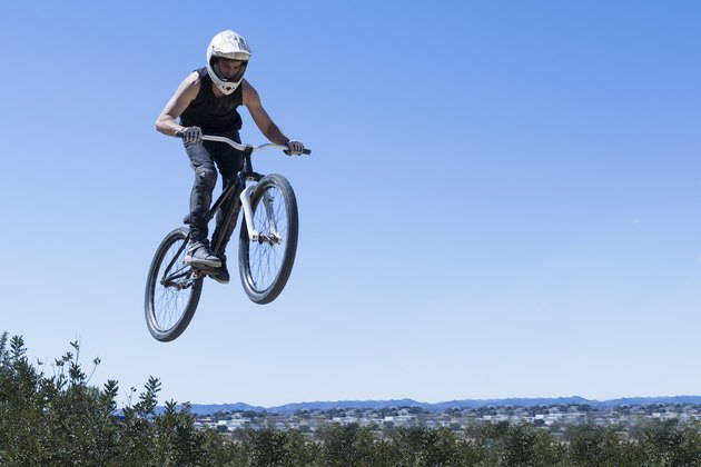 BMX rider jumping with bike