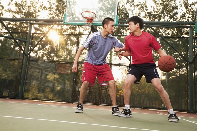 Two street basketball players on the basketball court