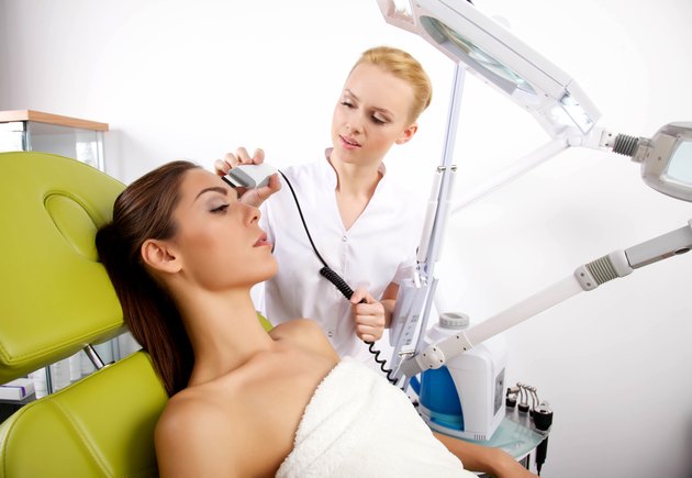 Young woman receiving laser therapy