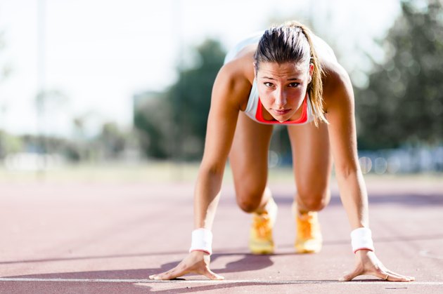 Female sprinter getting ready for the run