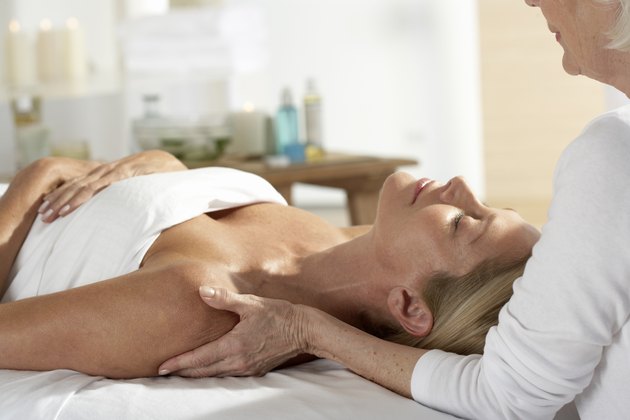 Woman laying on table having a massage