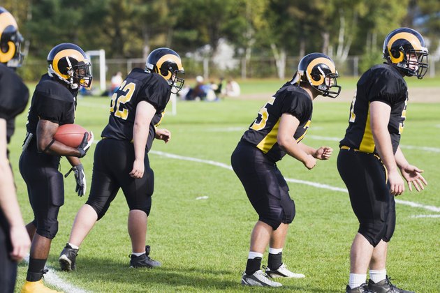 Football players playing in a field