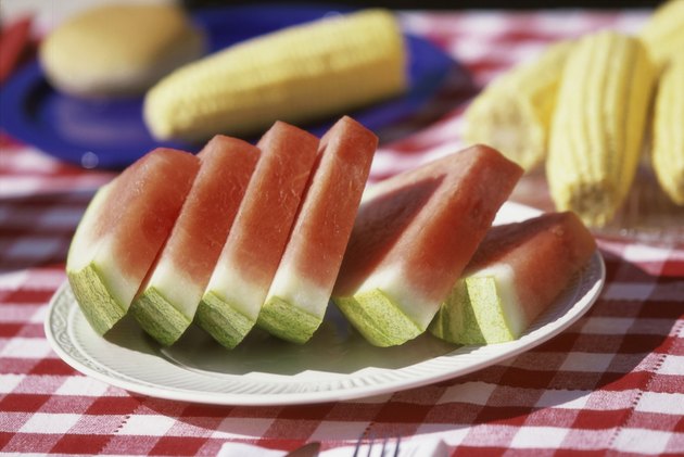 Close-up of watermelon slices on a plate on a picnic table