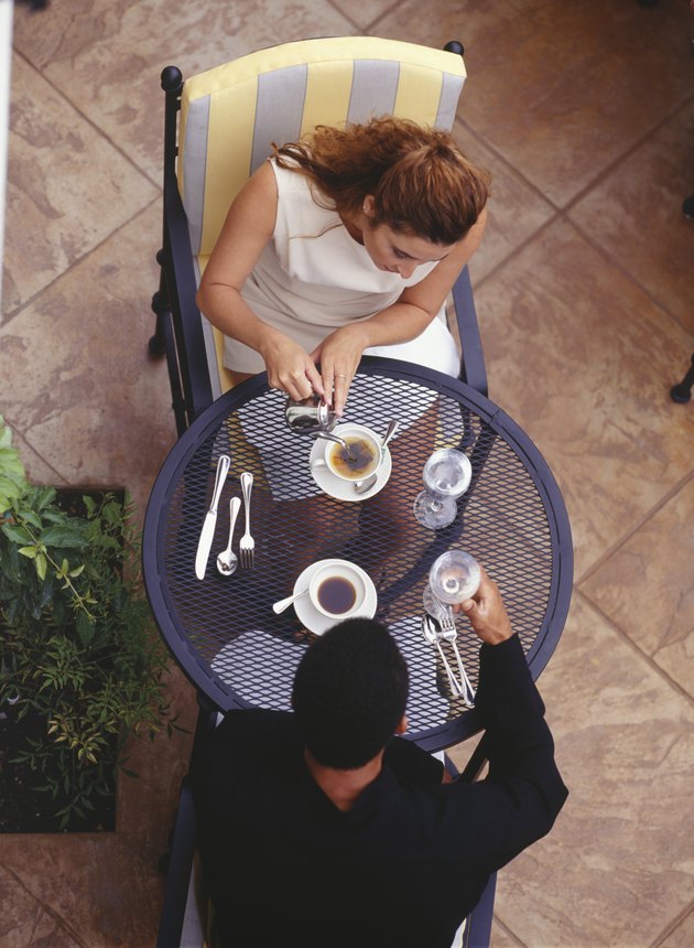 Couple sitting at outdoor cafe, elevated view