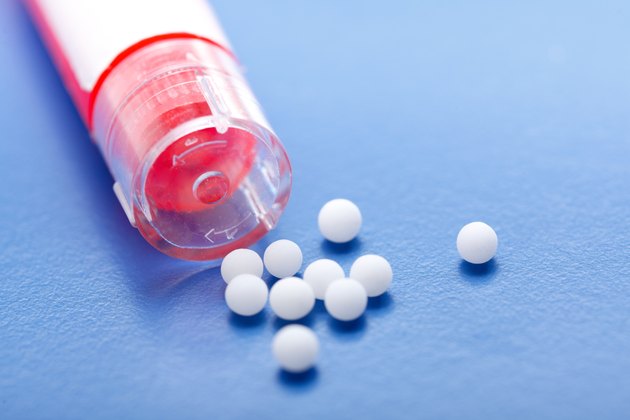 Modern homeopathic pills and container