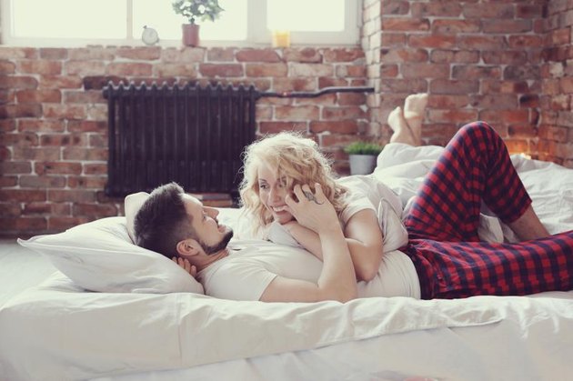 Lifestyle. Beautiful couple in bed