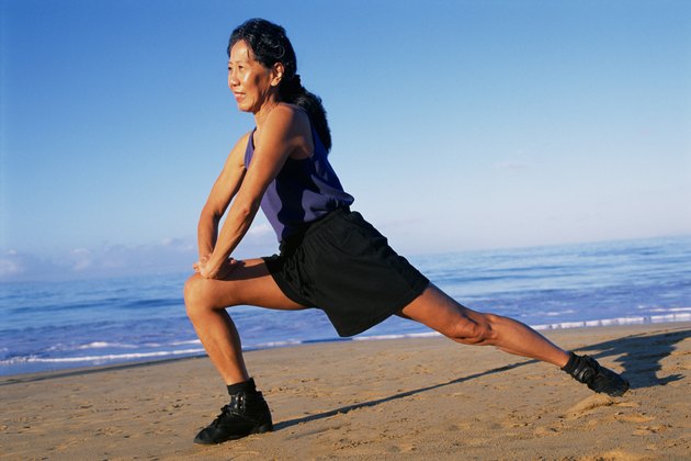 Woman stretching on beach