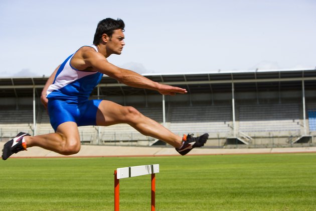 Man jumping a hurdle