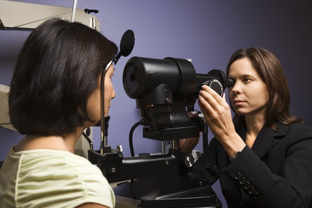 Woman getting eye exam