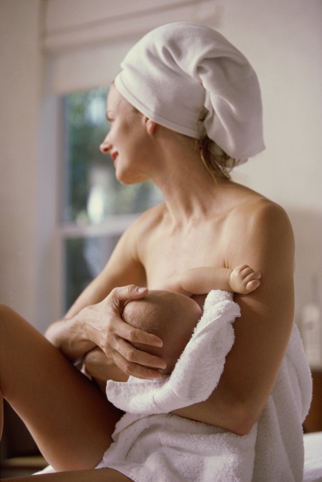 Mother breastfeeding her baby boy