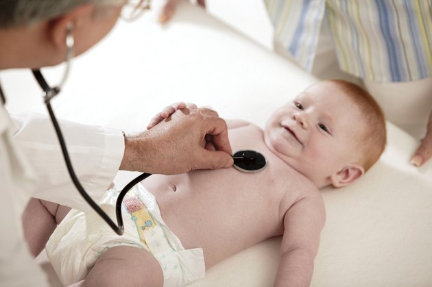 Doctor examining baby
